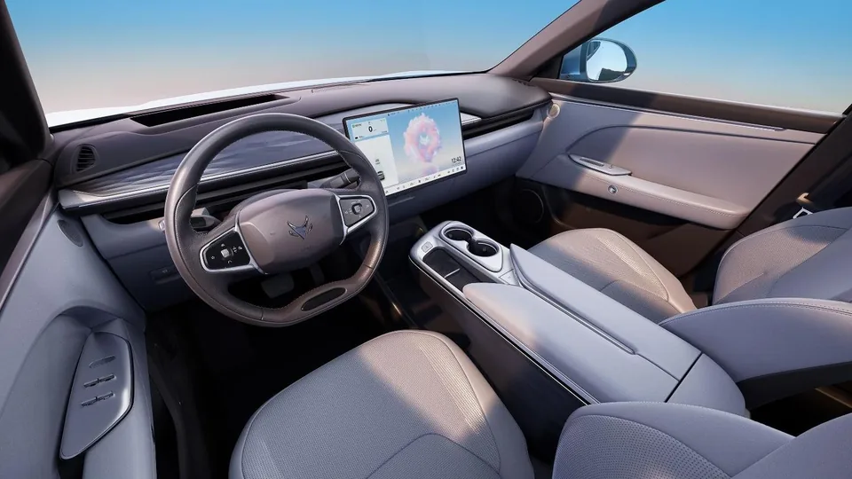 ARCFOX T5 front cabin with low dashboard, central display and pale seats