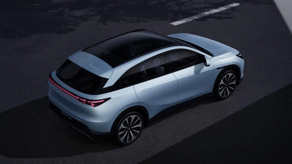 ARCFOX T5 viewed from above and behind, showing its panoramic roof and rear light bar